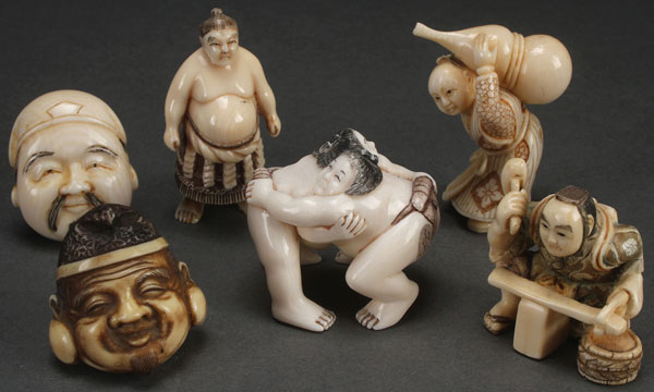 A GROUP OF SIX JAPANESE CARVED IVORY NETSUKES, PROBABLY MEIJI PERIOD. Each carved as a Kabuki mask,