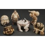 A GROUP OF SIX JAPANESE CARVED IVORY NETSUKES, PROBABLY MEIJI PERIOD. Each carved as a Kabuki mask,