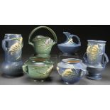 A COLLECTION OF SIX ROSEVILLE “FREESIA” ART POTTERY VASES, CIRCA 1945. In assorted shapes and