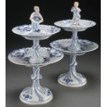 A PAIR OF MEISSEN BLUE AND WHITE TWO TIERED PORCELAIN SERVERS, 20TH CENTURY. Each decorated in the