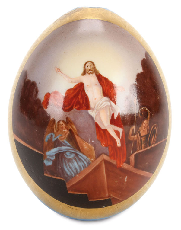 A LARGE RUSSIAN HAND PAINTED PORCELAIN EASTER EGG, 19TH CENTURY. The front of the egg painted with