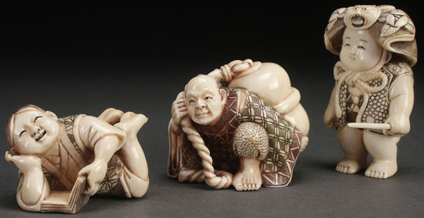 A GROUP OF THREE JAPANESE CARVED IVORY NETSUKES AND OKIMONO, PROBABLY MEIJI PERIOD. Each finely