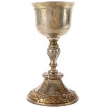 A RARE IMPERIAL RUSSIAN PRESENTATION SILVER GILT CHALICE, MOSCOW, 1863. The round base repousséd