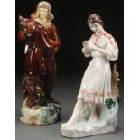 A PAIR OF RUSSIAN SOVIET GLAZED FIGURES, CIRCA 1950. Depicting a glazed ceramic hunter with fox,