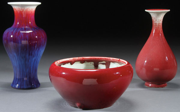 A CHINESE RED AND FLAMBÉ GLAZED PORCELAIN GROUP. Comprising a fine flambé decorated baluster vase,