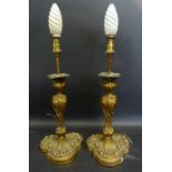 A Pair of Gilded Metal Candlesticks by E