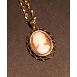 A 9ct. Gold Framed Cameo Pendant, togeth