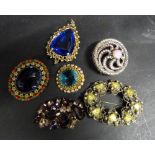 A Collection of Five Paste Set Brooches,