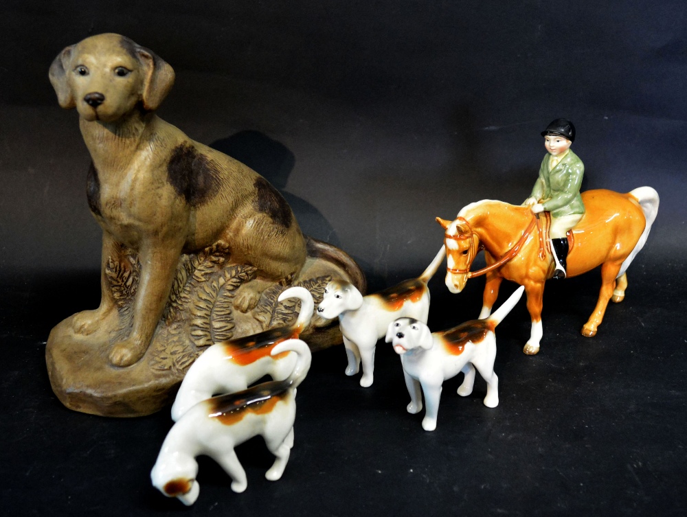 A Beswick Hunting Group with a Horse and Rider and Four Hounds,