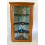 A 19th Century Pine Large Hanging Corner Cabinet with an Astragal Glazed Door Enclosing Shelves,