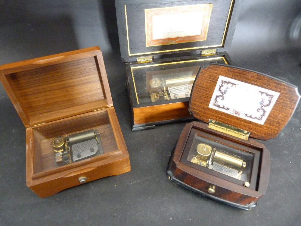 A Small Walnut Cased Musical Box Playing Four Airs,