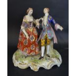 A Crown Derby Porcelain Group 'The Courting Couple' decorated in polychrome enamels and highlighted