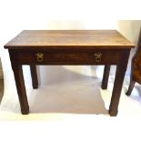 A 19th Century Oak Gothic Style Side Table with a frieze drawer with circular brass ring handles