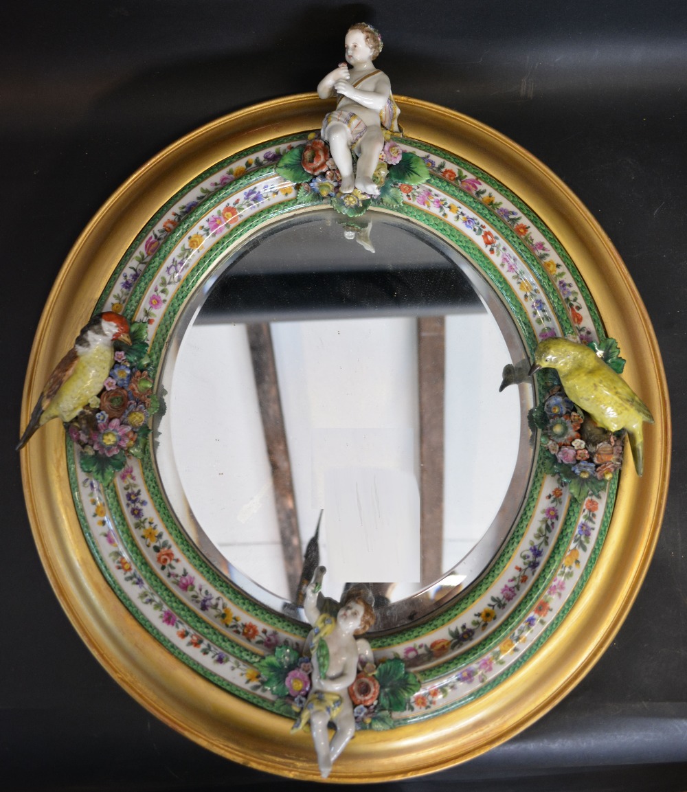 A 19th Century German Porcelain Wall Mirror of Oval Form,