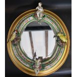 A 19th Century German Porcelain Wall Mirror of Oval Form,