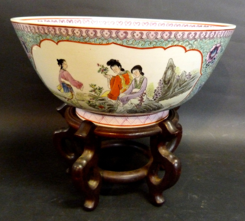 A 19th Century Chinese Large Famille Rose Bowl decorated in coloured enamels with reserves