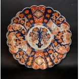 A Large 19th Century Imari Charger decorated in polychrome enamels within a shaped border (a/f)