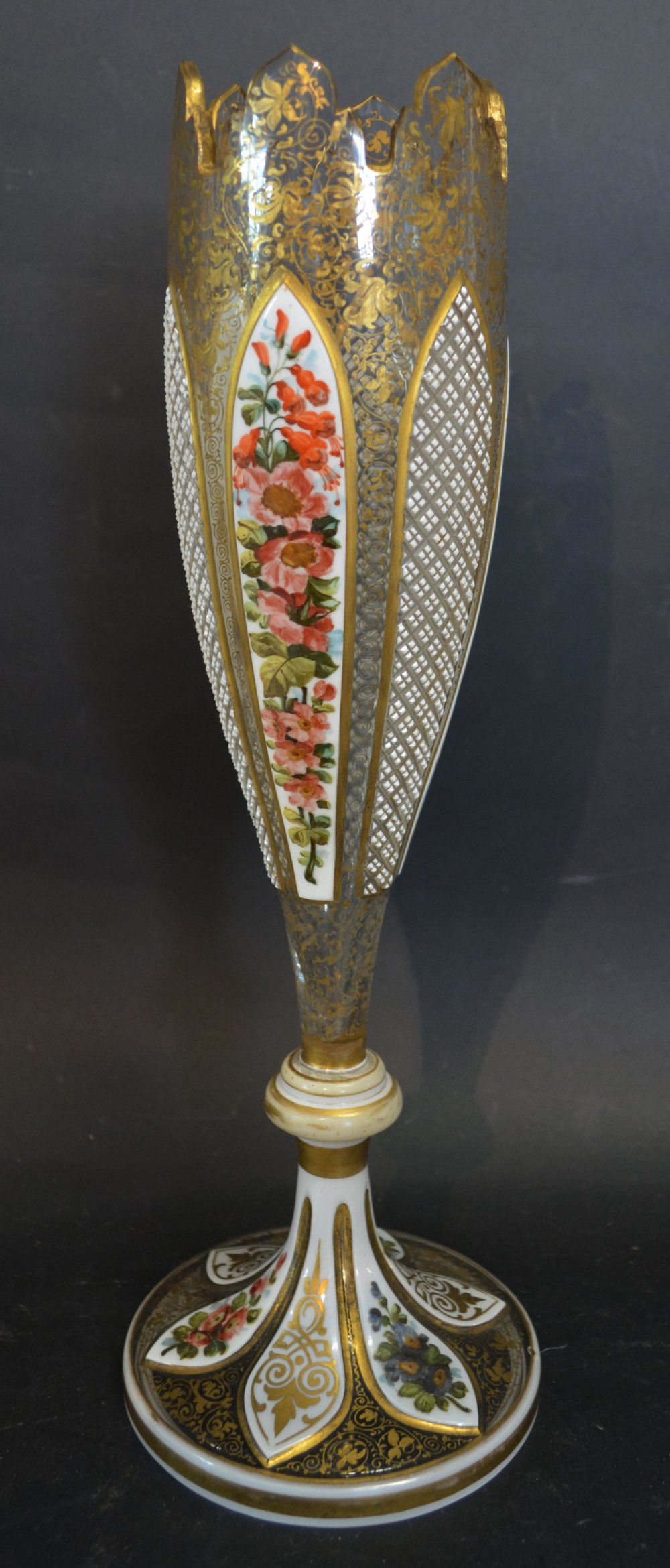 A 19th Century Bohemian Overlay Glass Oviform Vase, with foliate panels highlighted with gilt,