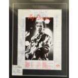 A Signed Photograph of Ry Cooder within a mounted frame,