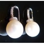 A Pair of 18ct. White Gold Pearl and Dia