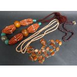 A Long Coral Bead Necklace together with