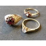 A 9ct. Gold Garnet Cluster Ring together