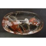 An Unusual Glass Paperweight decorated with birds amongst foliage