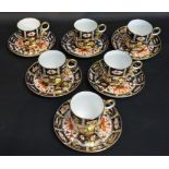 A Set of Six Royal Crown Derby Coffee Cans and Saucers decorated in the Imari palette