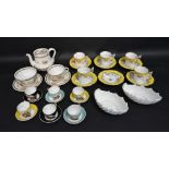 A Collection of German Porcelain Miniature Cups and Saucers,