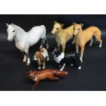 A Beswick Model of a Welsh Mountain Pony together with two Beswick models of Dogs,