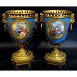 A Pair of French Sevres Style Porcelain Gilt Metal Mounted Urns,