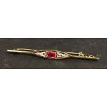 A Gold Bar Brooch Set With Diamonds And