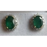 A Pair of 18ct. White Gold Emerald and D