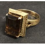 A 14ct. Gold Dress Ring with brown stone