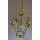 A Brass Hall Lantern with four glass panels,