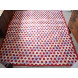 A Large Patchwork Quilt with an all over design,