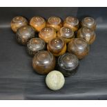 A Collection of Fourteen Lignumvitae Wooden Bowls together with a Jack