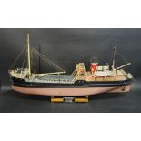 A Radio Controlled Model Boat, the SS Talacre, with wooden stand and park,