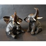 A Pair of Meiji Patinated Bronze Models in the form of Elephants with Tusks, seal mark to base,