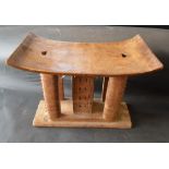 A Late 19th Early 20th Century Carved African Stool of Shaped Form,