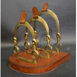 An Unusual Leather and Brass Three Division Letter Rack in the form of horse shoes,
