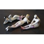 A Group of Three Porcelain Figures in the form of 1930's girls