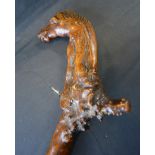 An Early Wooden Walking Cane, the head carved in the form of a horse,