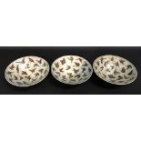 A Set of Three Chinese Pottery Shallow Bowls each decorated with butterflies, 7.