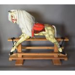 A Late 19th Early 20th Century Large Rocking Horse, dapple grey with pine stand,