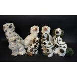 A Large Pair of Staffordshire Models of Dogs together with five similar Staffordshire models of