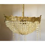 A Late 19th Early 20th Century Ormolu Bag Light Fitting with cut glass facet drops,
