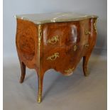 A Louis XVI Style Bombe Commode with a r