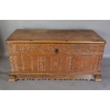 A George III Oak Coffer, a plank top abo