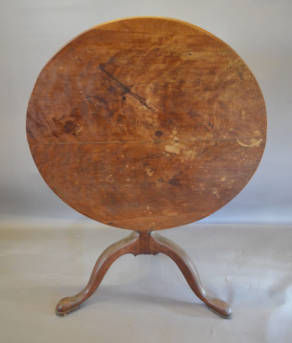A George III Tilt Top Table, the circula